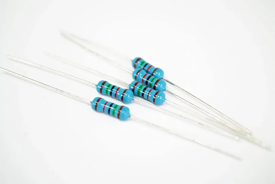 A selection of capacitors and resistors of different sizes.