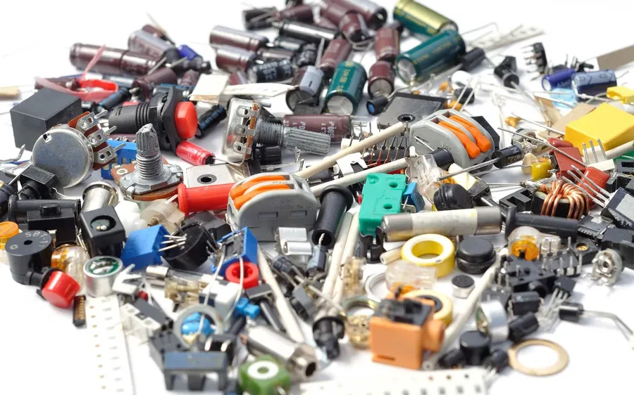 A view of an electronics store shelf with various components.