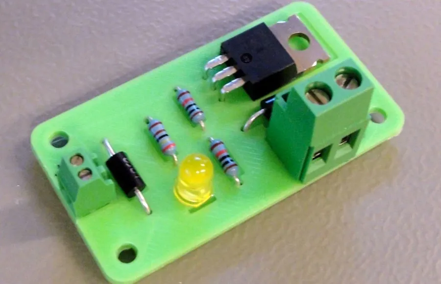 A 3D printer in operation, creating a circuit board.
