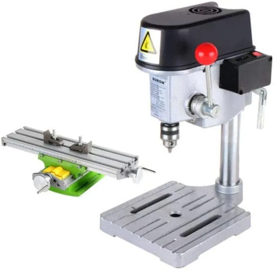 A close-up of a PCB being drilled with a drill press.