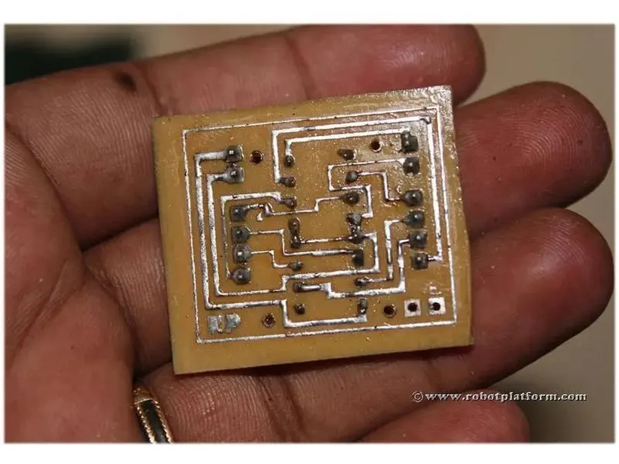 A PCB board during the chemical etching process.