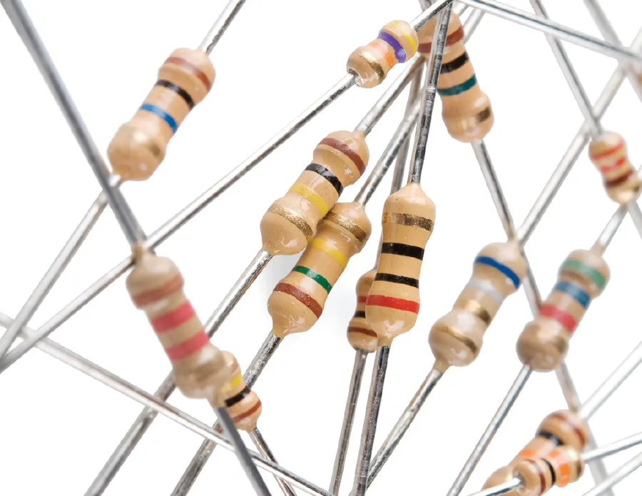 A close-up of various electronic resistors with different color bands.