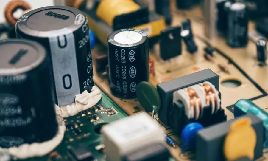 A printed circuit board showing 104J capacitors in use.