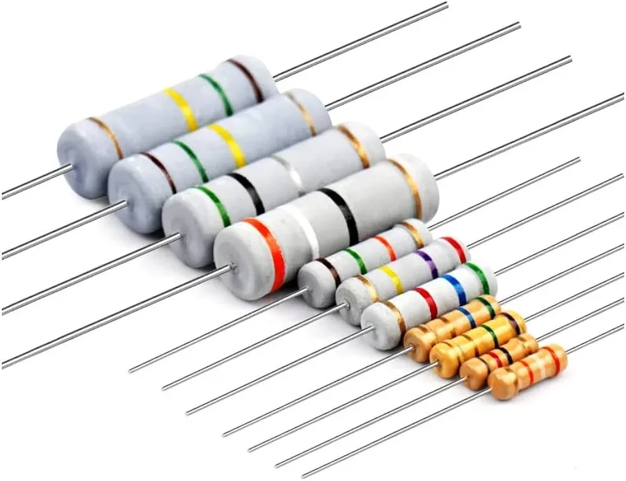 Several carbon film resistors on a white surface.