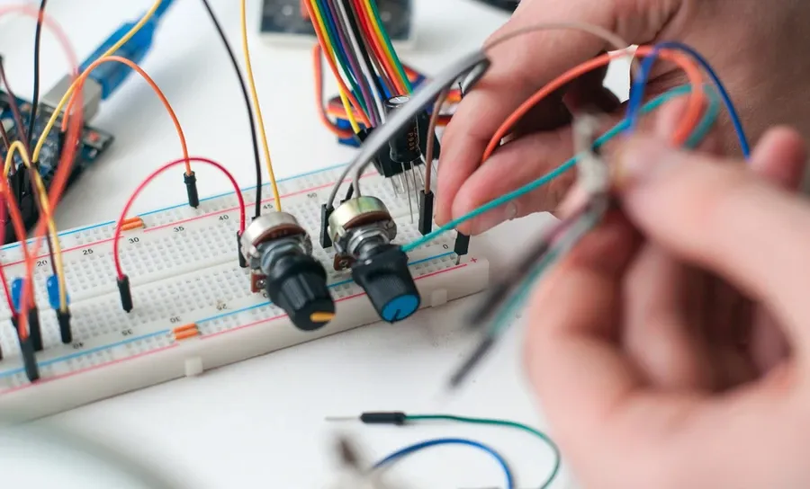 Various circuits and electronic components arranged on a solderless breadboard for prototyping.