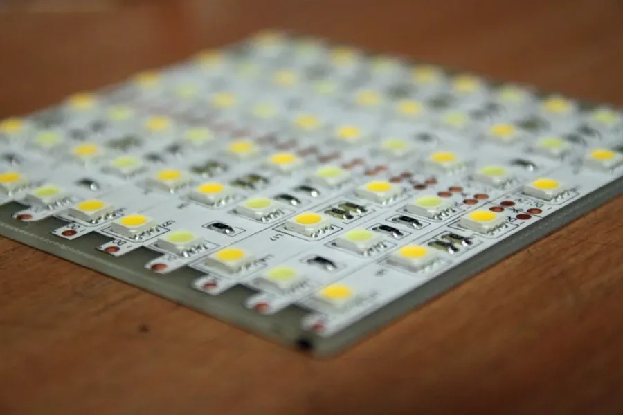 A simple LED circuit on a breadboard with a power supply and a resistor.