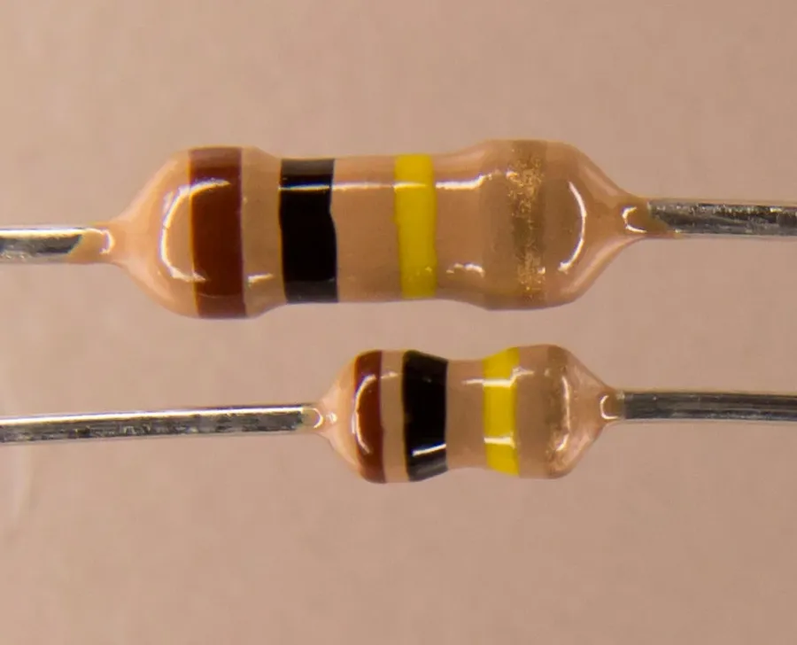 A collection of different through-hole resistors with their leads visible.
