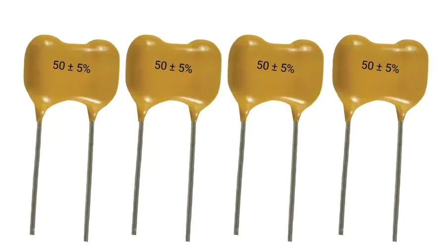 A silver mica capacitor used in a precision circuit board.