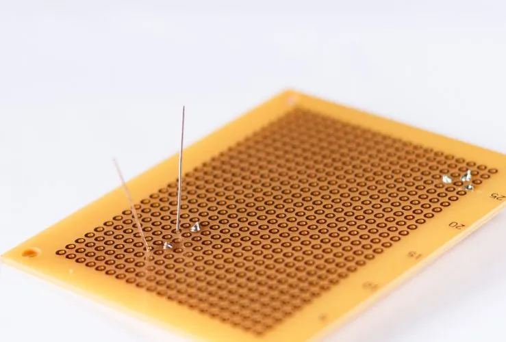 Several PCB prototypes laid out, showing different designs