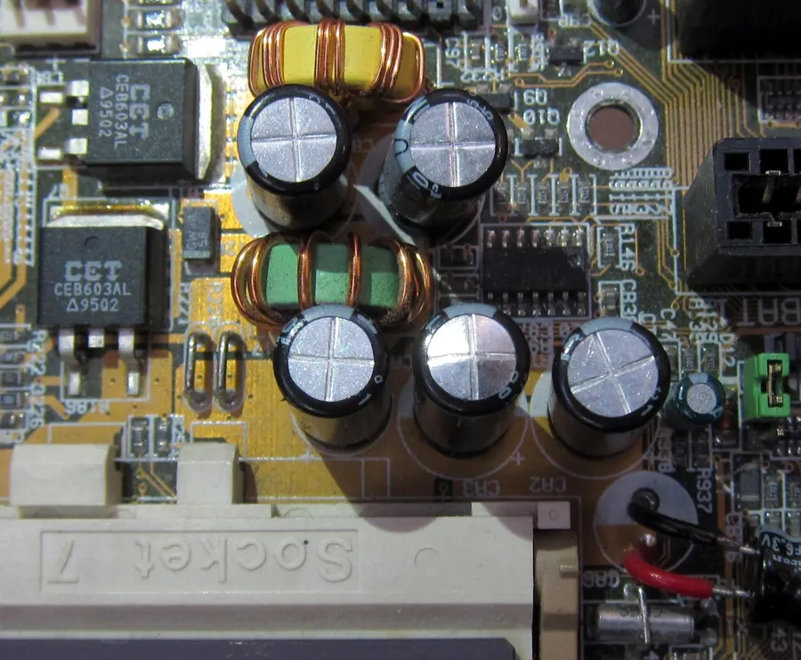 A picture of a swollen or damaged capacitor.