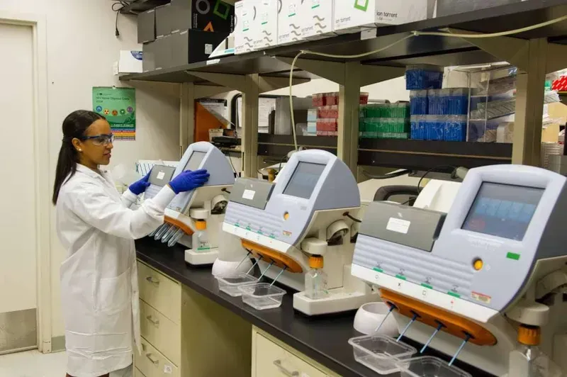A technician performing quality control tests on a medical device