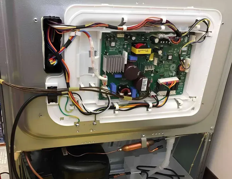 An internal view of a smart refrigerator showing PCB installation