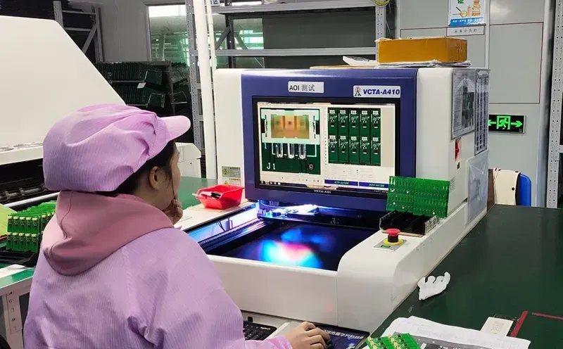 Testing equipment inspecting a PCB for quality assurance